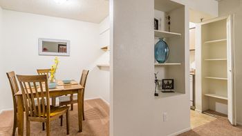 El Encanto decorative shelves near dining table. 
